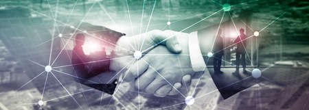 Blockchain network on blurred skyscrapers background. Financial technology and communication concept.の写真素材