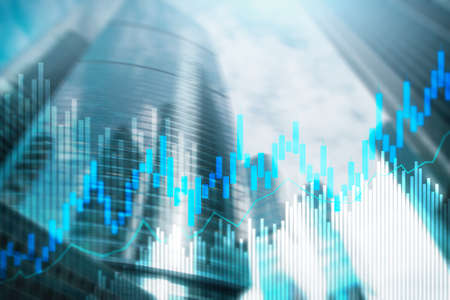 Stock trading candlestick chart and diagrams on blurred office center background.