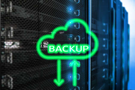 Backup button on modern server room background. Data loss prevention. System recovery.