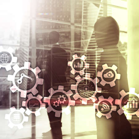 Automation technology and smart industry concept on blurred abstract background. Gears and icons.の写真素材