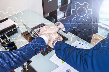 Double exposure gears mechanism on blurred background. Business and industrial process automation...