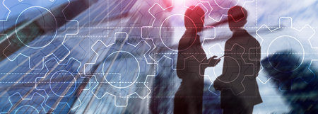 Double exposure gears mechanism on blurred background. Business and industrial process automation...