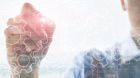 Double exposure gears mechanism on blurred background. Business and industrial process automation concept.の写真素材