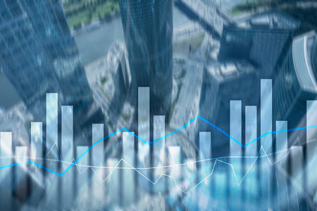 Financial graphs and charts on blurred business center background. Invesment and trading concept.