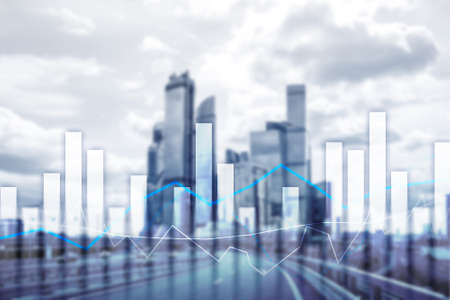 Financial graphs and charts on blurred business center background. Invesment and trading concept.の写真素材