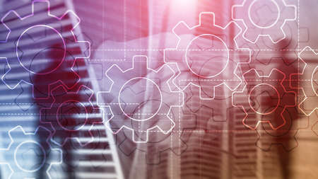 Double exposure gears mechanism on blurred background. Business and industrial process automation concept.の写真素材