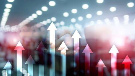Up arrow graph on skyscraper background. Invesment and financial growth concept.の写真素材