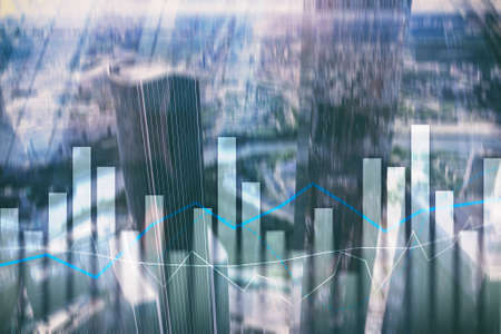Financial graphs and charts on blurred business center background. Invesment and trading concept.の写真素材