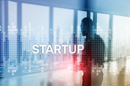 Startup concept with double exposure diagrams blurred background.