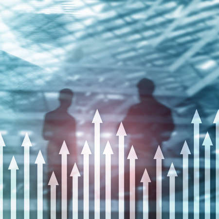 Up arrow graph on skyscraper background. Invesment and financial growth concept.の写真素材