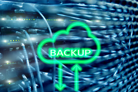 Backup button on modern server room background. Data loss prevention. System recovery.