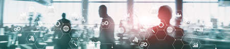 Double exposure mixed media. Diagrams and icons on hologram screen. Business people and modern city on background. Website header banner.の写真素材