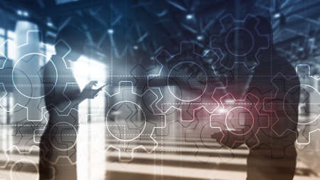 Double exposure gears mechanism on blurred background. Business and industrial process automation concept.の写真素材