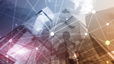 Blockchain network on blurred skyscrapers background. Financial technology and communication concept.の写真素材