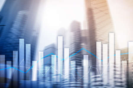Financial graphs and charts on blurred business center background. Invesment and trading concept.