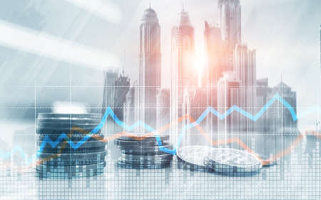 Double exposure of city and rows of coins with stock and financial graph on virtual screen. Business Investment concept.