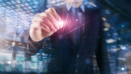 Blockchain network on blurred skyscrapers background. Financial technology and communication concept.の写真素材