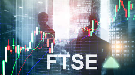 FTSE 100 Financial Times Stock Exchange Index United Kingdom UK England Investment Trading concept with chart and graphs.の写真素材