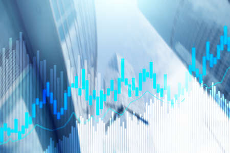 Stock trading candlestick chart and diagrams on blurred office center background.