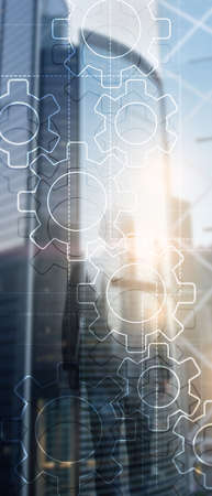 Vertical Panorama Banner. Double exposure gears mechanism on blurred background. Business and...