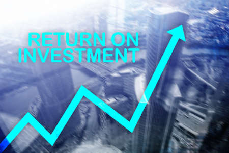 ROI - Return on investment. Stock trading and financial growth concept on blurred business center...