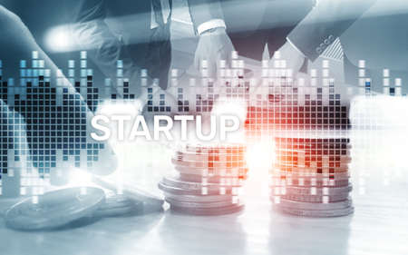 Successful teamwork and business startup concept. Inscription on the screen: Startup. Business World...