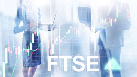 FTSE 100 Financial Times Stock Exchange Index United Kingdom UK England Investment Trading concept with chart and graphsの写真素材