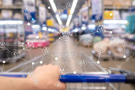 Shopping cart structure Retail marketing E-commerce blurred supermarket backgroundの写真素材