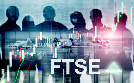 FTSE 100 Financial Times Stock Exchange Index United Kingdom UK England Investment Trading concept with chart and graphs.の写真素材