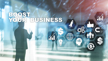 Financial and Technology concept. On a virtual screen inscription: Boost Your Businessの写真素材