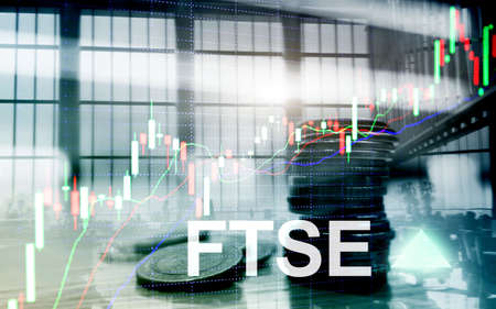 FTSE 100 Financial Times Stock Exchange Index United Kingdom UK England Investment Trading concept with chart and graphs.の写真素材