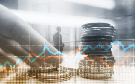 Double exposure of city and rows of coins with stock and financial graph on virtual screen. Business...