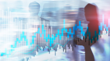 Stock trading candlestick chart and diagrams on blurred office center background.