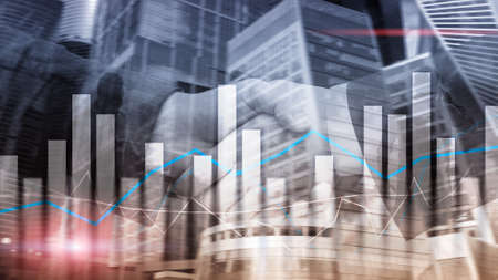 Financial graphs and charts on blurred business center background. Invesment and trading conceptの写真素材