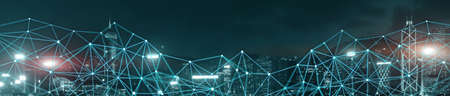 Network on city skyline at night. Connecting technology concept. Blue Lines web.