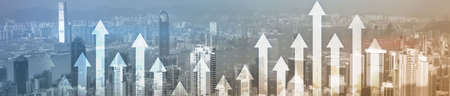 Financial growth concept. Up arrows on modern night city. Panoramic business background