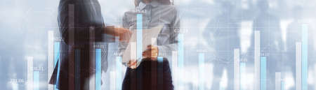 Business growth, progress or success concept. Financial bar chart and growing graphs with on blue background.の写真素材