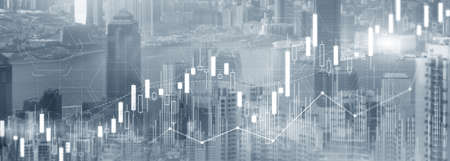 Stock trading, investment, candle stock market chart diagram website header banner city view skyline.の写真素材