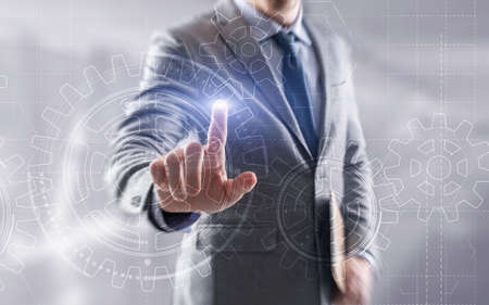 Businessman hand draws gear to success concept. 3D Gear Virtual Screen.の写真素材