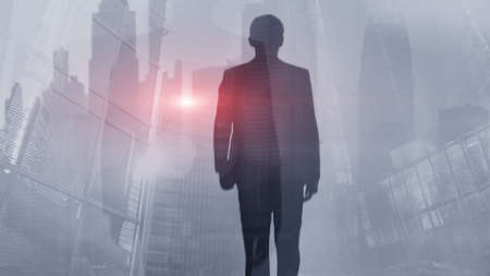 Silhouette of a man on the background of the cityの写真素材