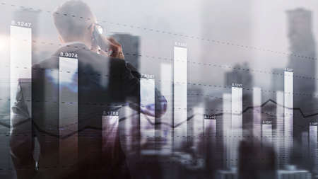 Diagram on the background of silhouettes and the city. Business candle stick graph chart. Trend of graph.の写真素材