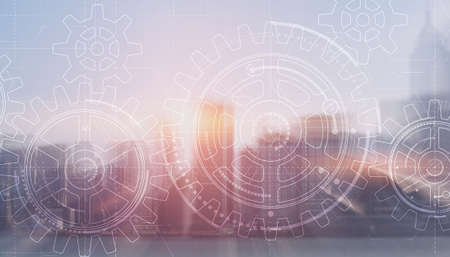 Gears on modern architecture background. Business processes conceptの写真素材
