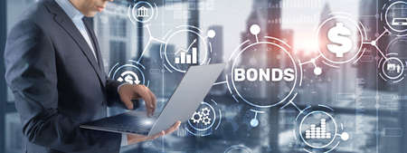 Businessman clicks a bonds virtual screen. Bond Finance Banking Technology concept. Trade Market Networkの写真素材