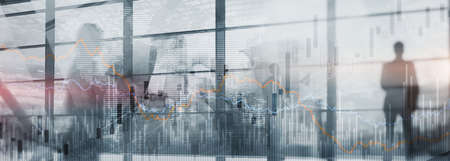 Silhouettes of people on the background of financial graphs and chartsの写真素材