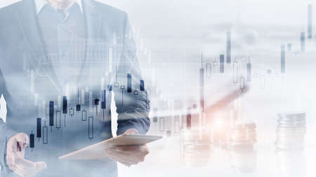 Analysis concept. Financial graph on city scape background double exposureの写真素材