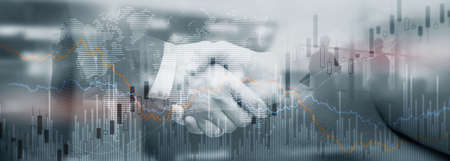 Silhouettes of people on the background of financial graphs and chartsの写真素材