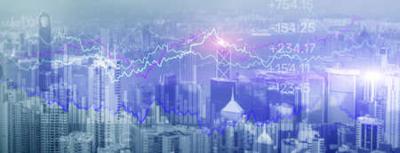 Double exposure Financial graphs and diagrams. Business, economics and investment concept on modern city backgroundの写真素材