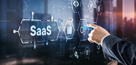 SaaS Software as a Service concept with man hand pressing textの写真素材