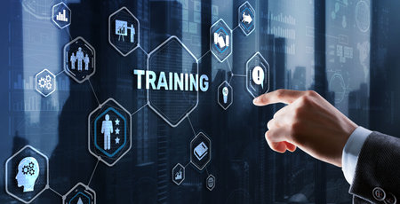 Trainning concept. Businessman pressing on touch screen interface inscriptionの写真素材