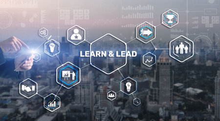Learn and Lead. Businessman presses hand on the virtual screen inscriptionの写真素材